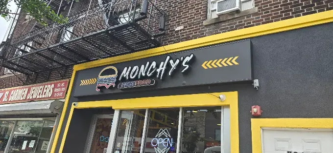 Monchy's storefront with its yellow neon sign, one of its 3 locations in New Jersey