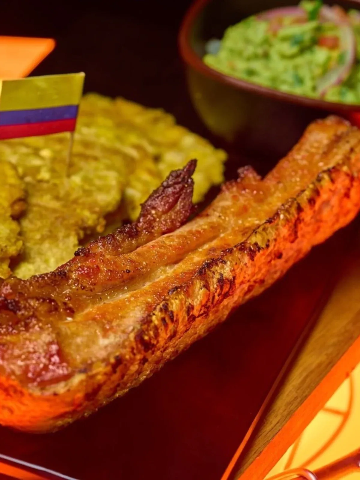 Smoked chicharrón with tostones and guacamole at Barrel House