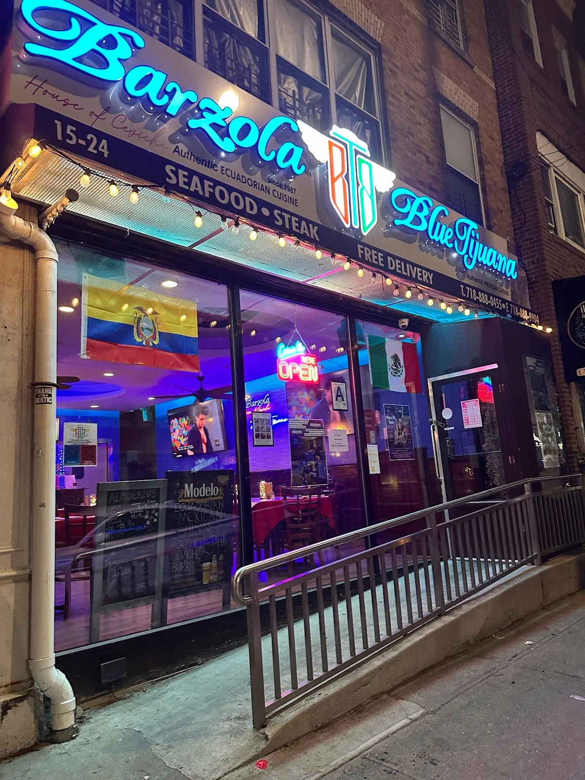 The Barzola & Blue Tijuana storefront on College Point Blvd at night