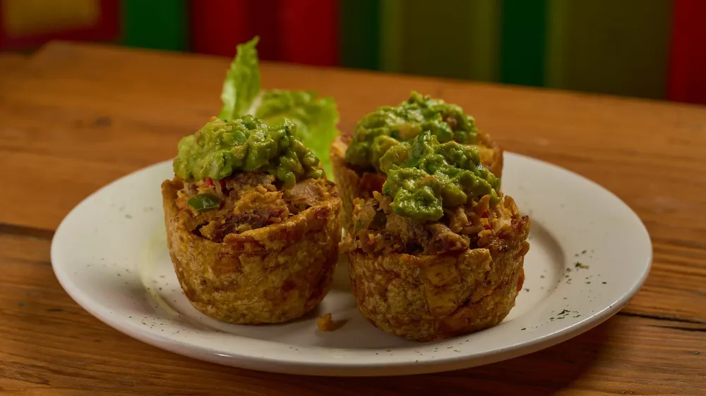 Stuffed tostones topped with guacamole