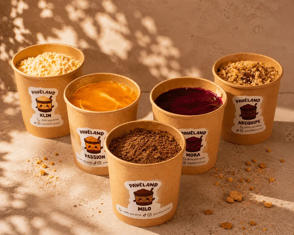 Paveland dessert cups with layered toppings and rich creams in warm sunlight