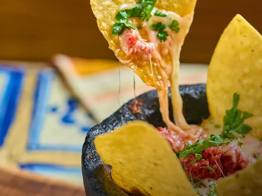 Queso fundido with tortilla chips