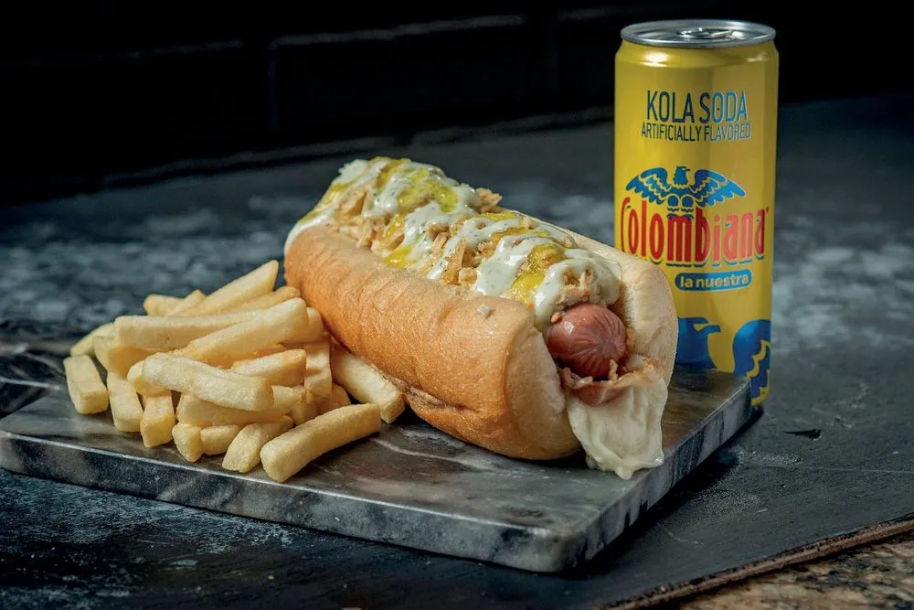 Hot dog with fries and a Colombiana soda