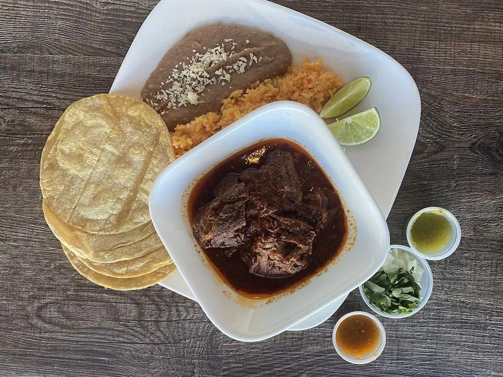 Birria plate with rice, beans and corn tortillas