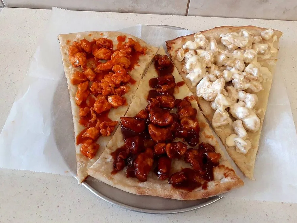 Buffalo, BBQ and white chicken pizza slices