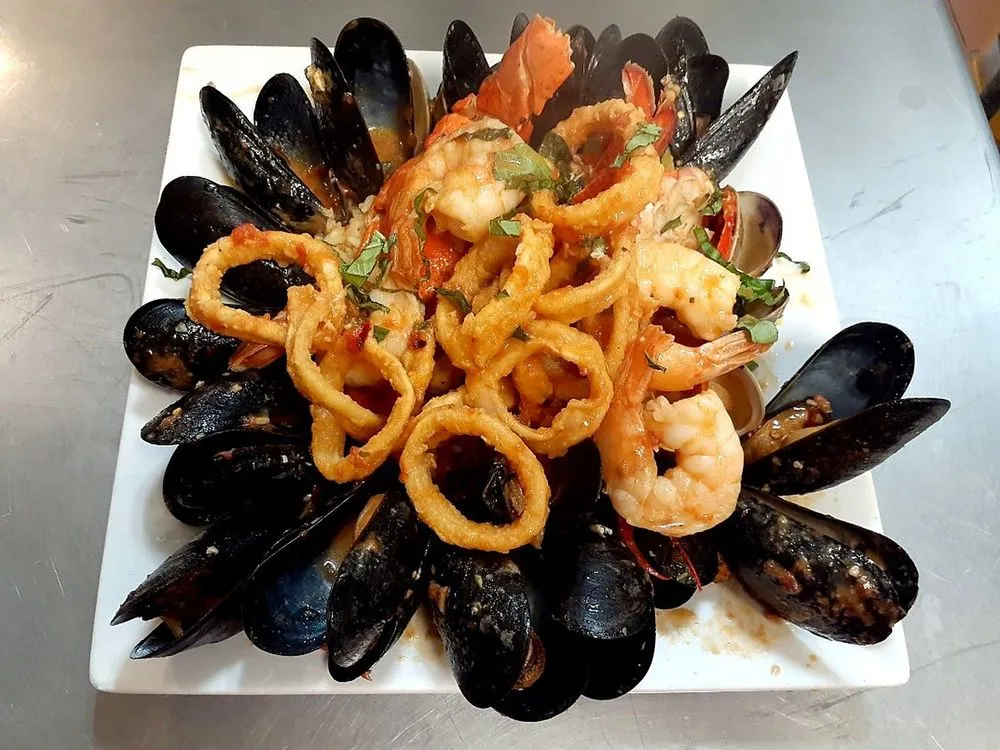 Seafood platter with mussels, shrimp and fried calamari in red sauce