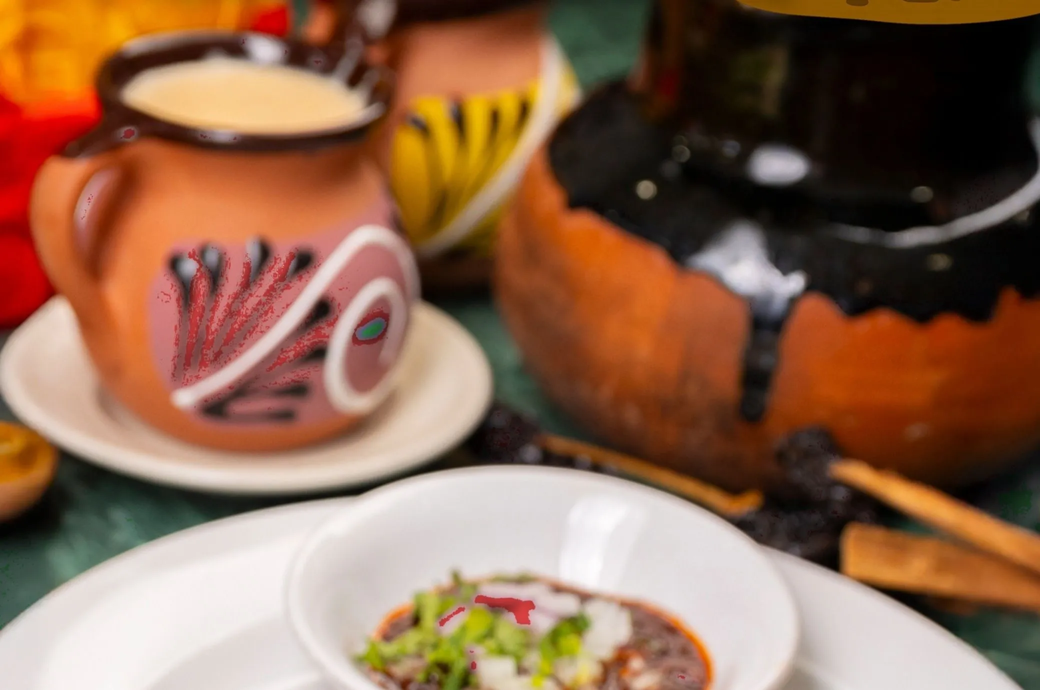 Clay jars and a pot of Mexican cooking at Taqueria Amigos