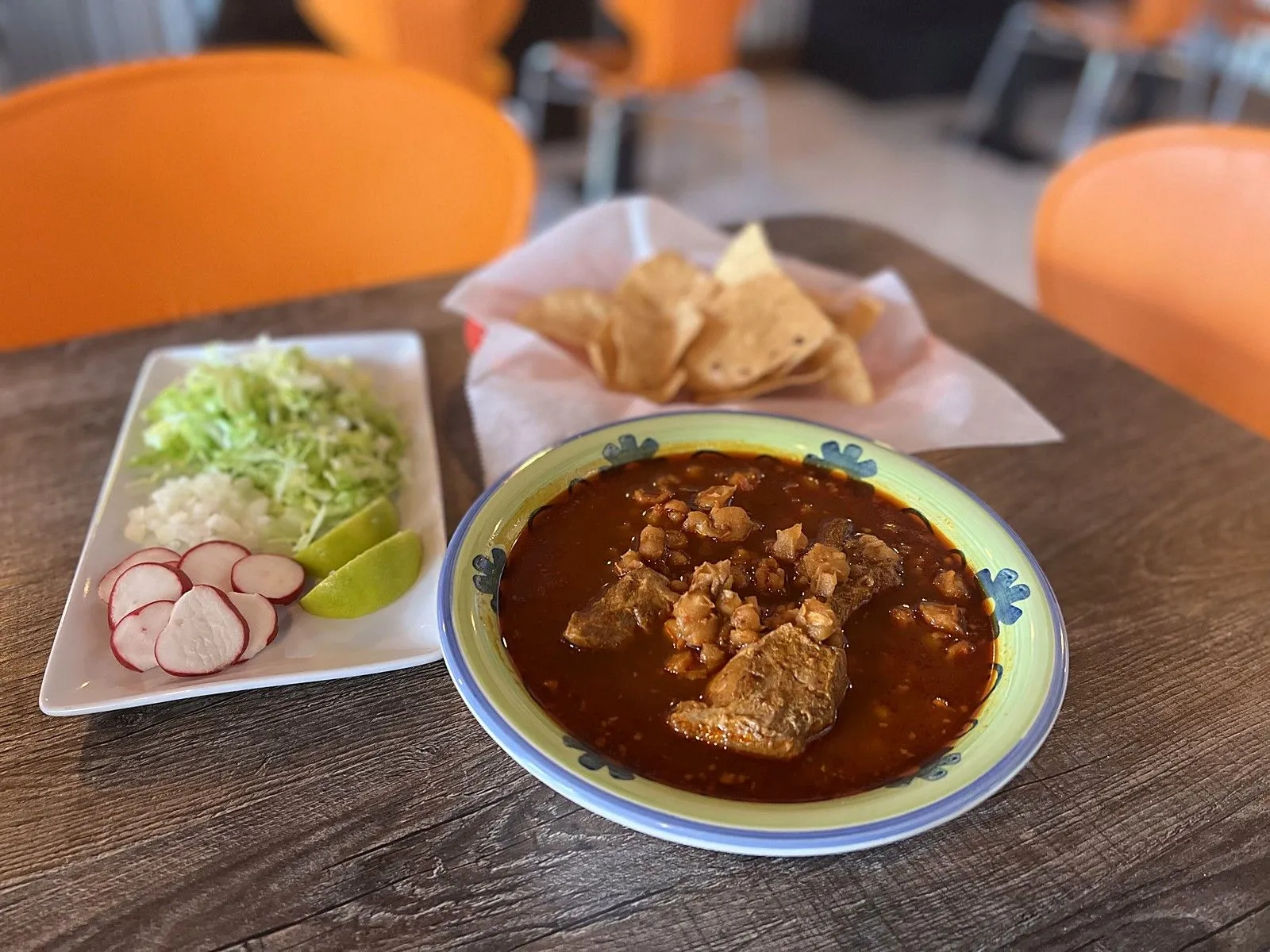 Pozole with radish, lettuce and tortilla chips in the Super Tacos dining room